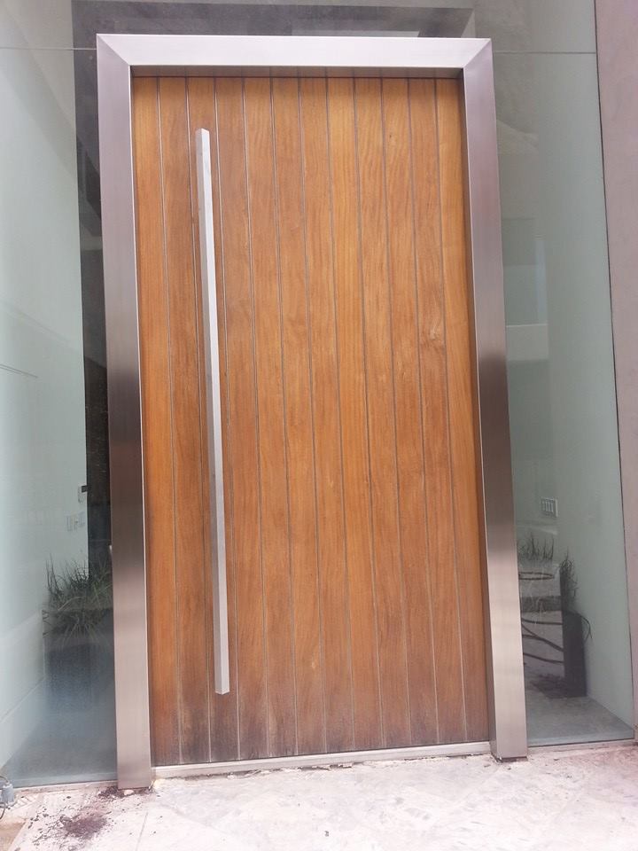 Custom wood and stainless steel entry door — metal fabrication Phoenix AZ