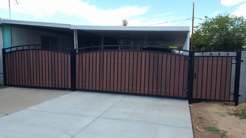 Steel-framed driveway gate with wood composite panels — Phoenix AZ