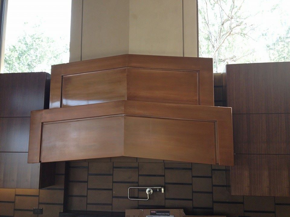 Corner copper range hood — custom kitchen metalwork Phoenix AZ
