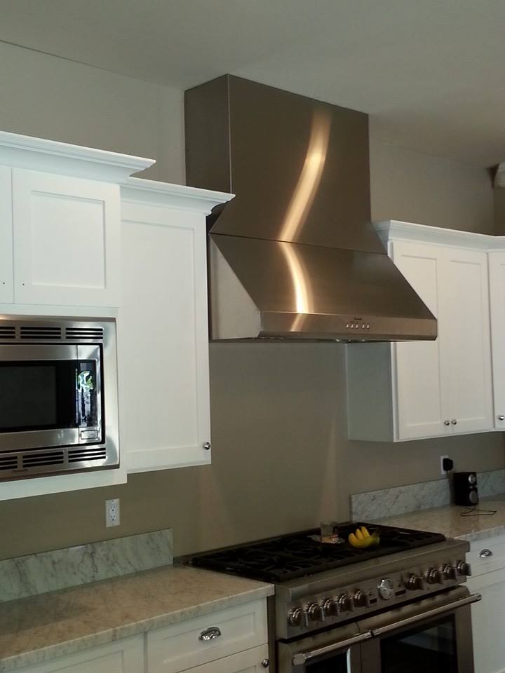 Brushed stainless steel range hood in white kitchen — Phoenix AZ