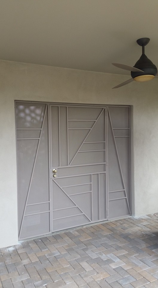 Geometric steel security door with diagonal pattern — custom gate Phoenix AZ